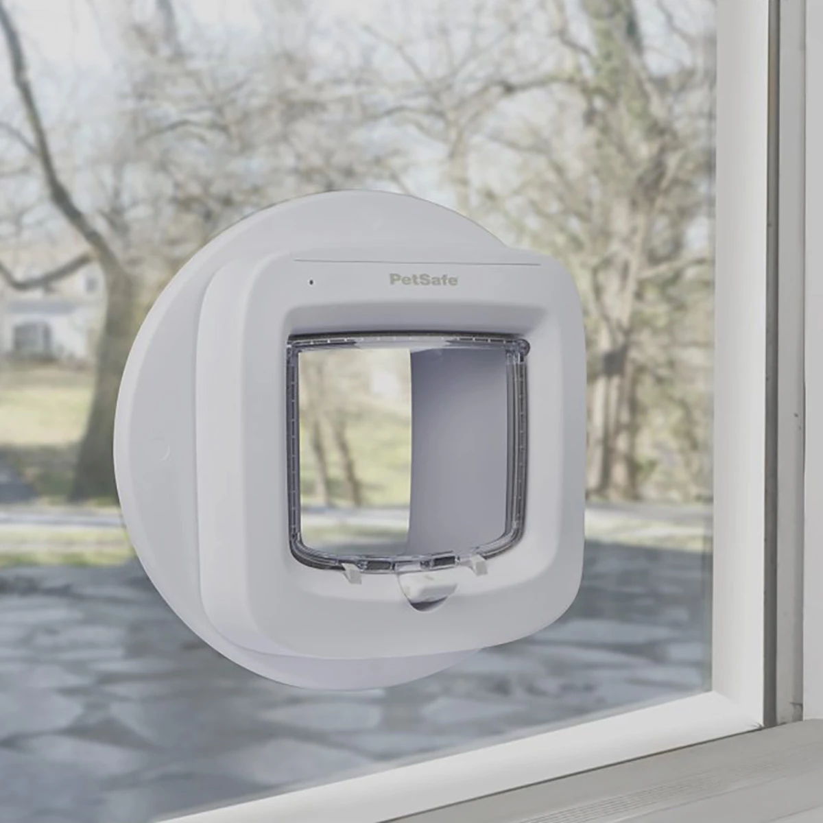 Microchip cat flap installed into a double glazed glass door using a mounting adaptor